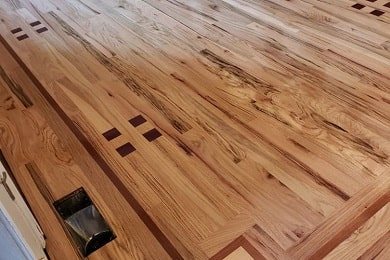 Custom hickory floor with inlay detail